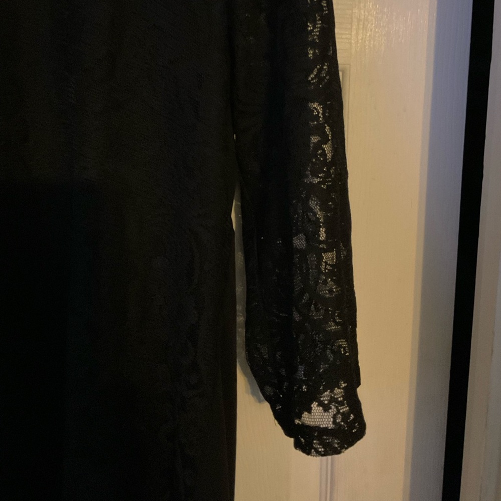 Women’s Cato brand size 14/16 lace lined 3quarters sleeves. High/low